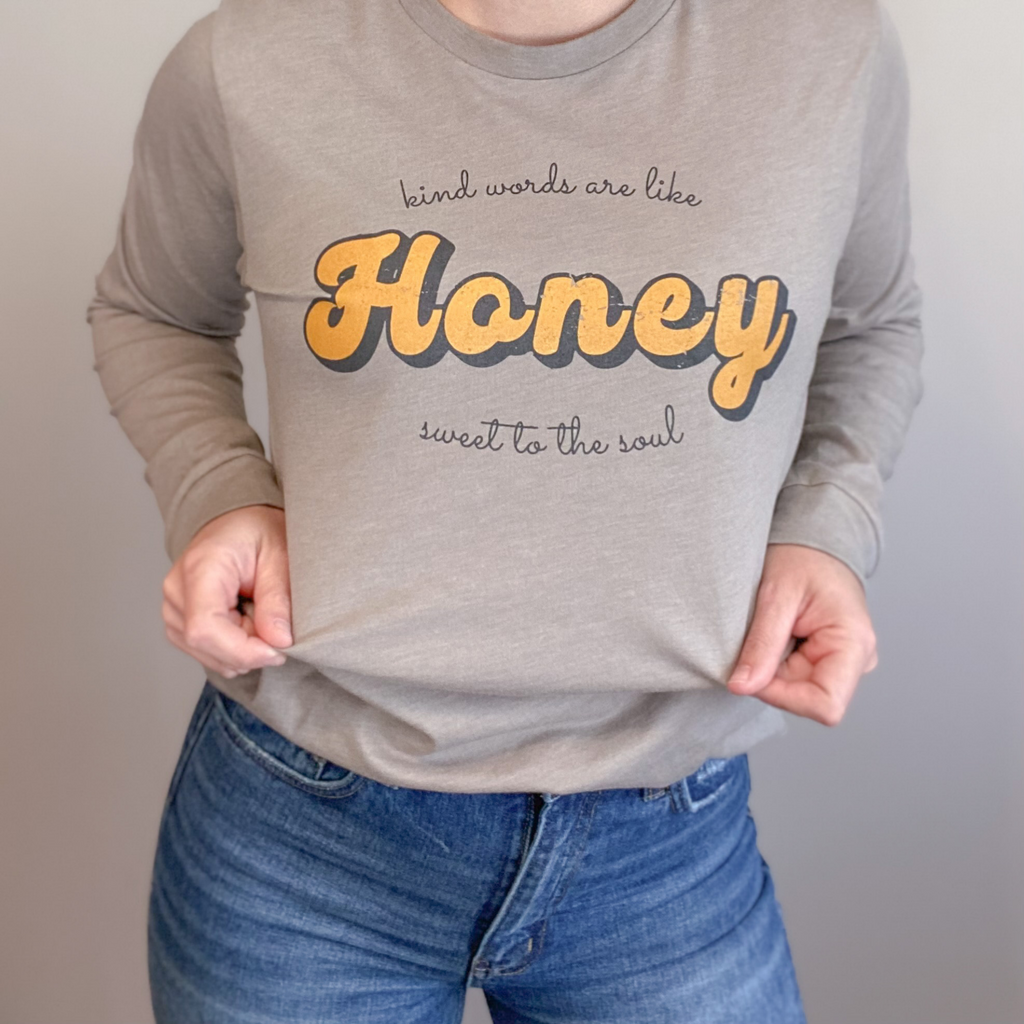 Kind words are like honey, sweet to the soul screen printed on a tan long sleeve shirt