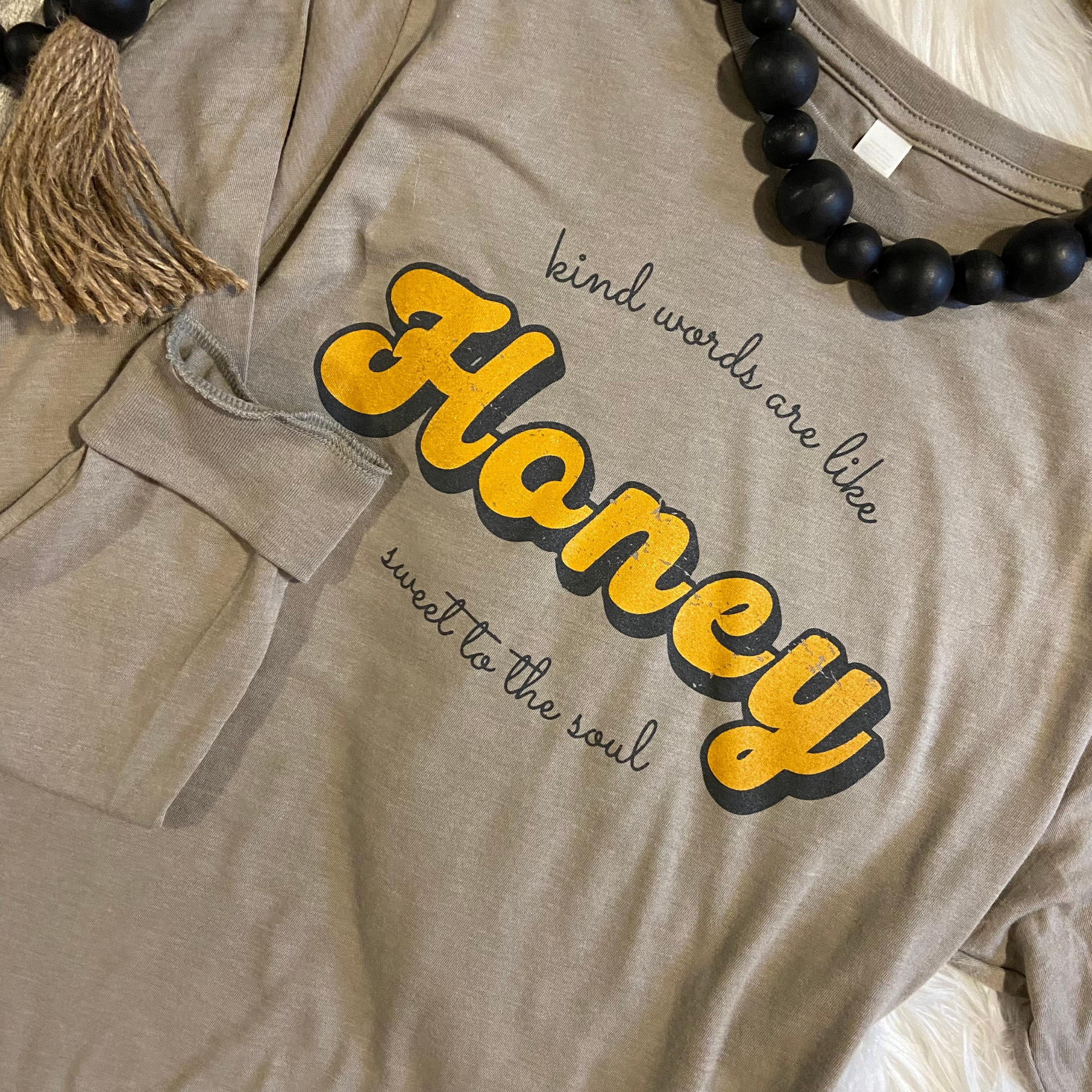 Kind words are like honey, sweet to the soul screen printed on a tan long sleeve shirt
