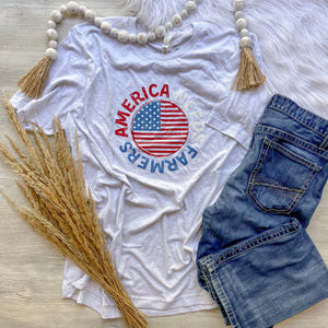Grey tshirt that says America Needs Farmers in red white and blue with an american flag